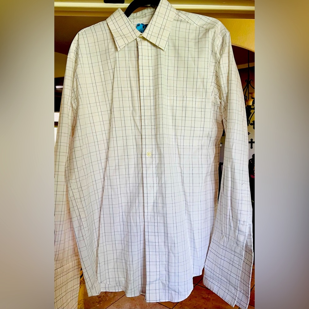 Stylish collared/button up shirt.